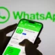 A conceptual illustration showing WhatsApp usernames nigeria, digital identity, cybersecurity shields and phishing warning icons against a Nigerian digital landscape.